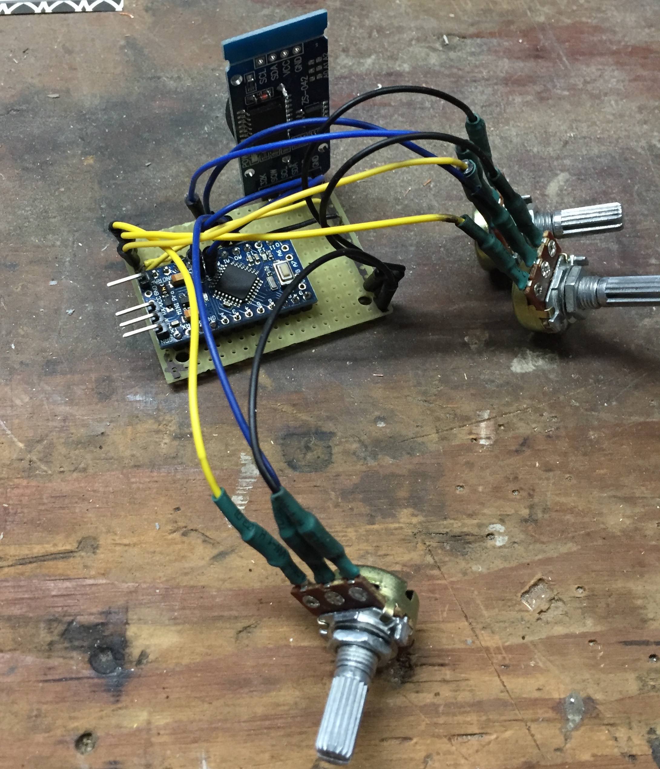 Pro mini, RTC, and potentiometers for setting temperature and start/end times.